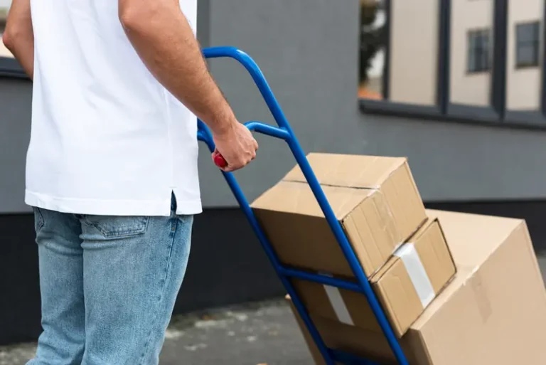Boxes on a hand truck ready for courier pickup