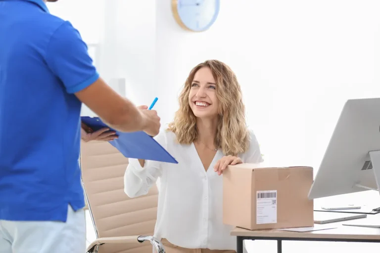 Courier delivering a package to a business client