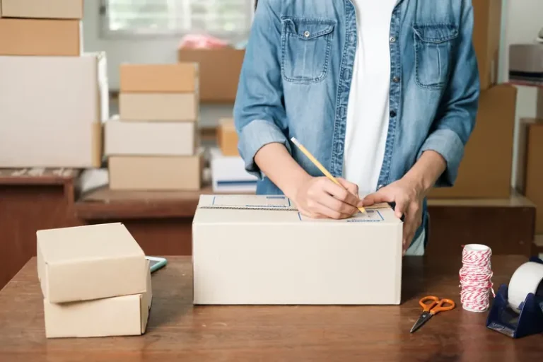 Online store order being packed in a box