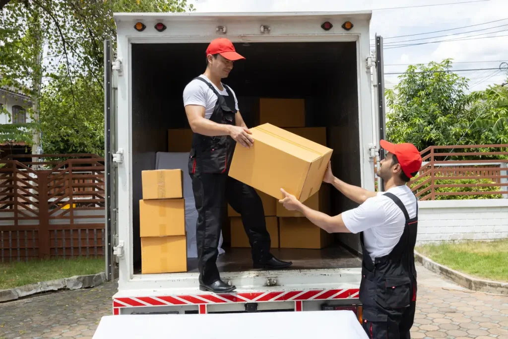 Movers loading boxes into a moving truck